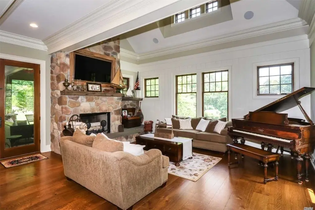 family room fireplace and grand piano
